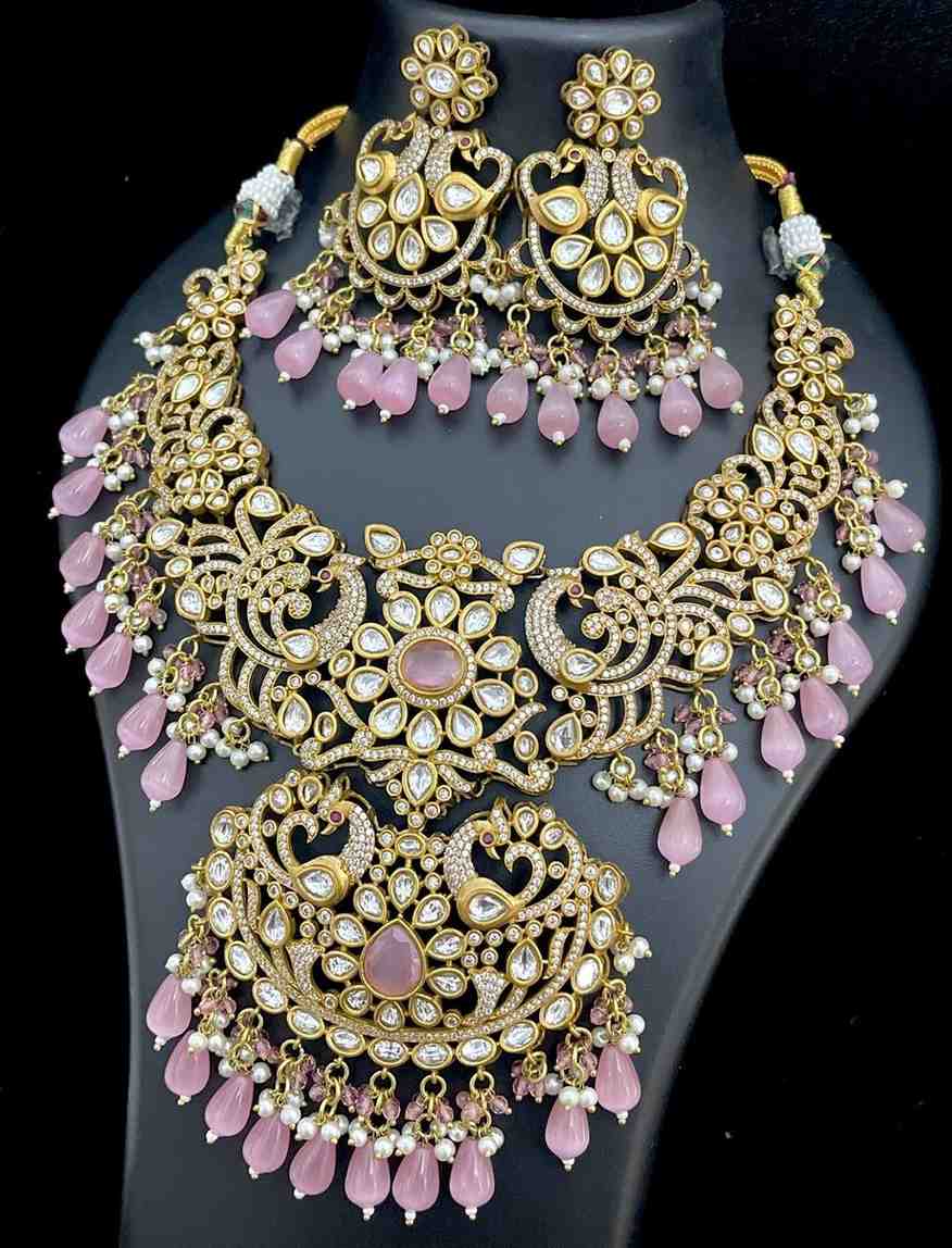 A premium quality celebrity look mozonite. Stonework necklace with beautiful earrings